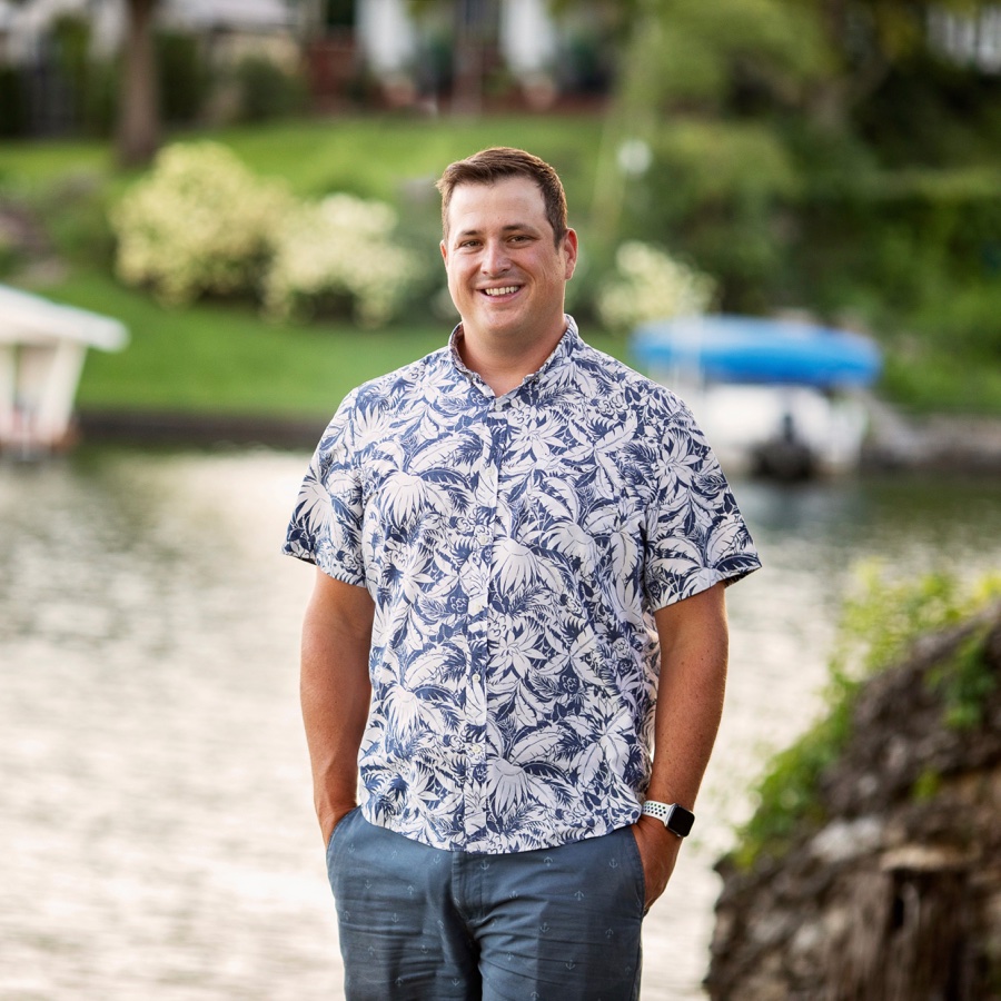 Noel Runkle, Editor and Publisher of the Lotawana News, standing at the lake